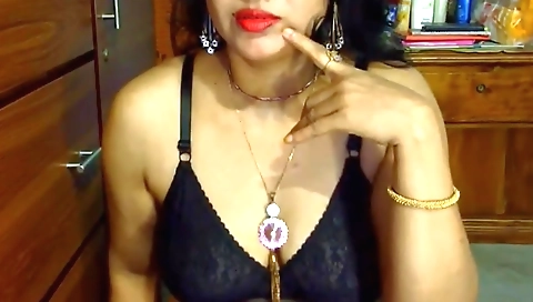 Indian slut masturbating in her bed in her bedroom