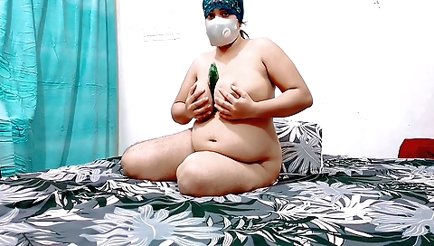 Muslim chick wearing a sexy red dress in the bedroom