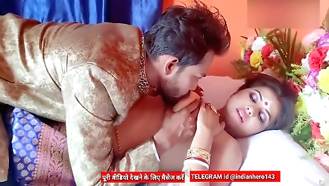 Indian busty milf makes out with a guy in front of a camera