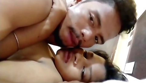 Busty indian teen with a black dress is making out