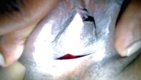 Black top and shorts amateur brunette plays with hair