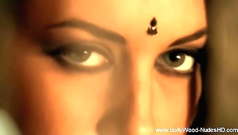 Gorgeous brunette naked girl in a white blouse and shorts