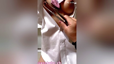 Training her nipples with tongs in a tight little black outfit