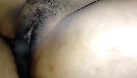 Busty teen with hairy pussy sucking on a black dick