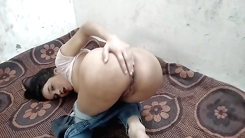 Indian brunette in a red dress showing a lot of herself