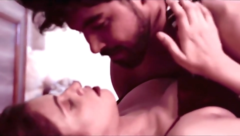 Red-haired milf sells her clothes and accessories to a young guy