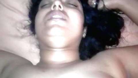 Indian brunette with large tits and an ass enjoys porn