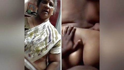 Indian granny in a pink dress gets fucked by a man