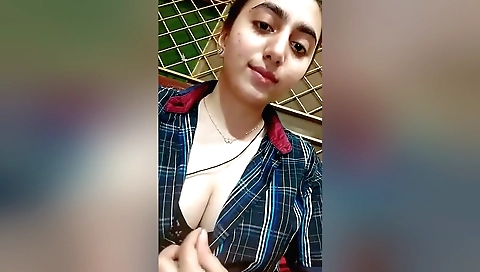 Sexy brunette with a shaved pussy shows her body with thighs