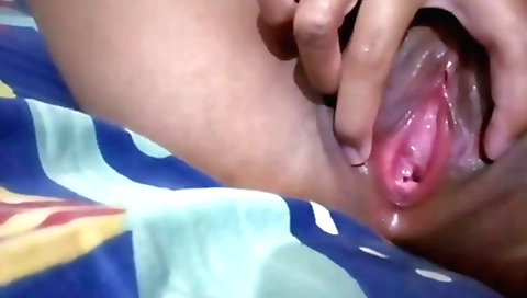 Indian amateur milf sucks and plays with her pussy in solo video