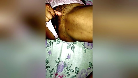 Indian hairy girl shows off her hairy pussy on the bed