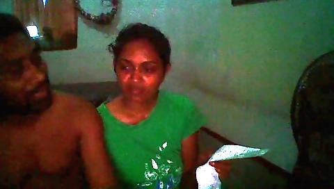 Indian brunette in the hotel room is checking her phone