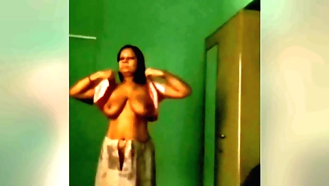 A brunette with a fat ass is wearing cute lingerie in solo video