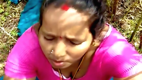 Indian brunette in a red dress and stockings in open